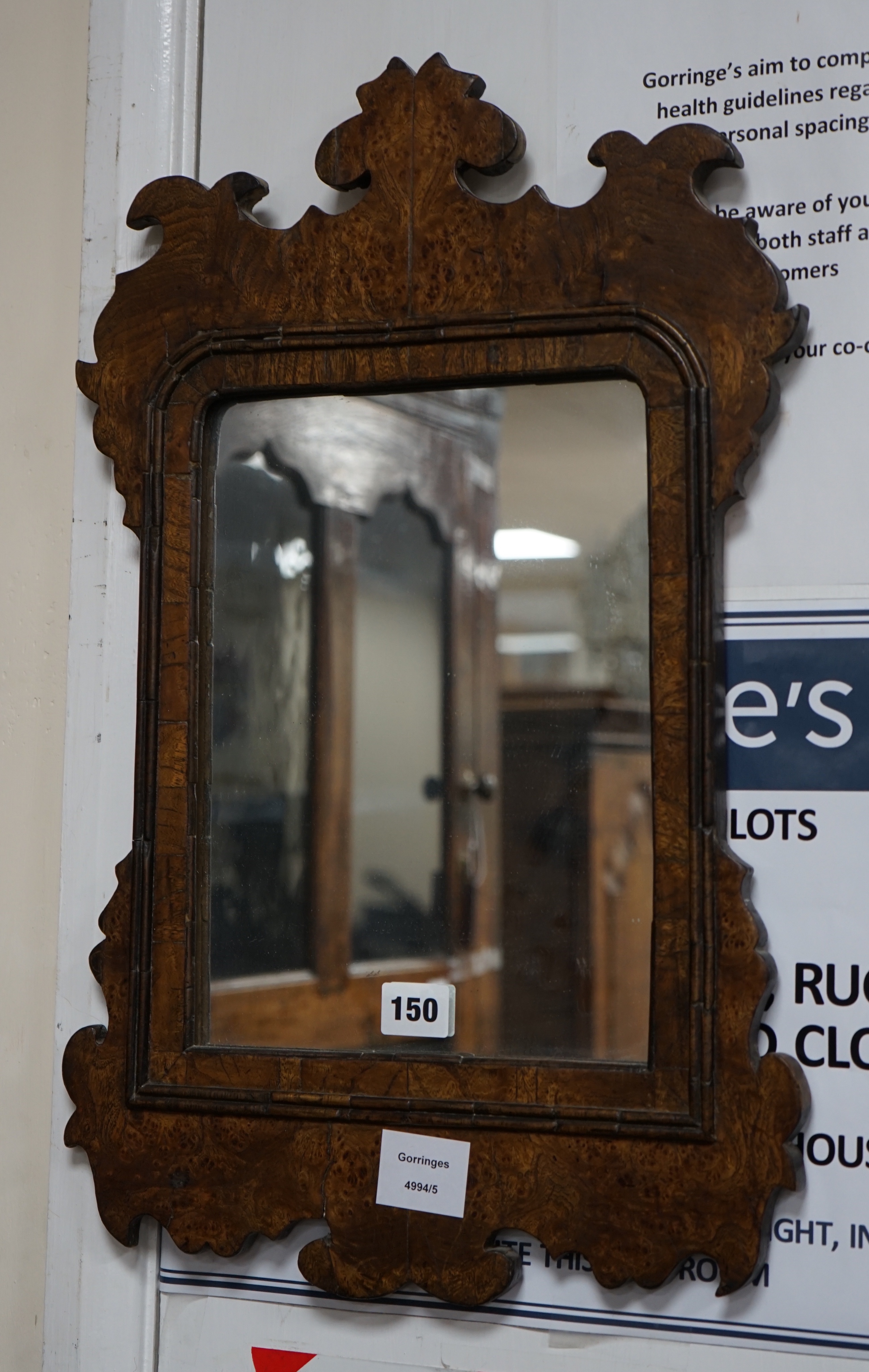 A small burr oak veneered fret cut wall mirror, width 34cm height 53cm